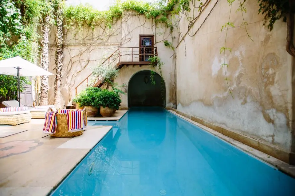 The community pool with lounge chairs